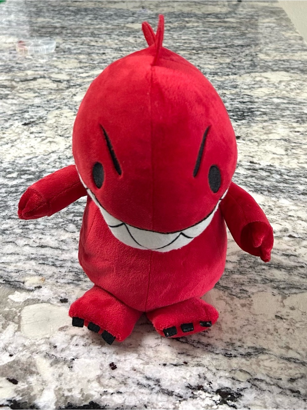 Red Plush Dinosaur with Big White Teeth